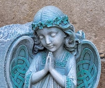 Picture of angel statue placed by the CWL in the parish garden