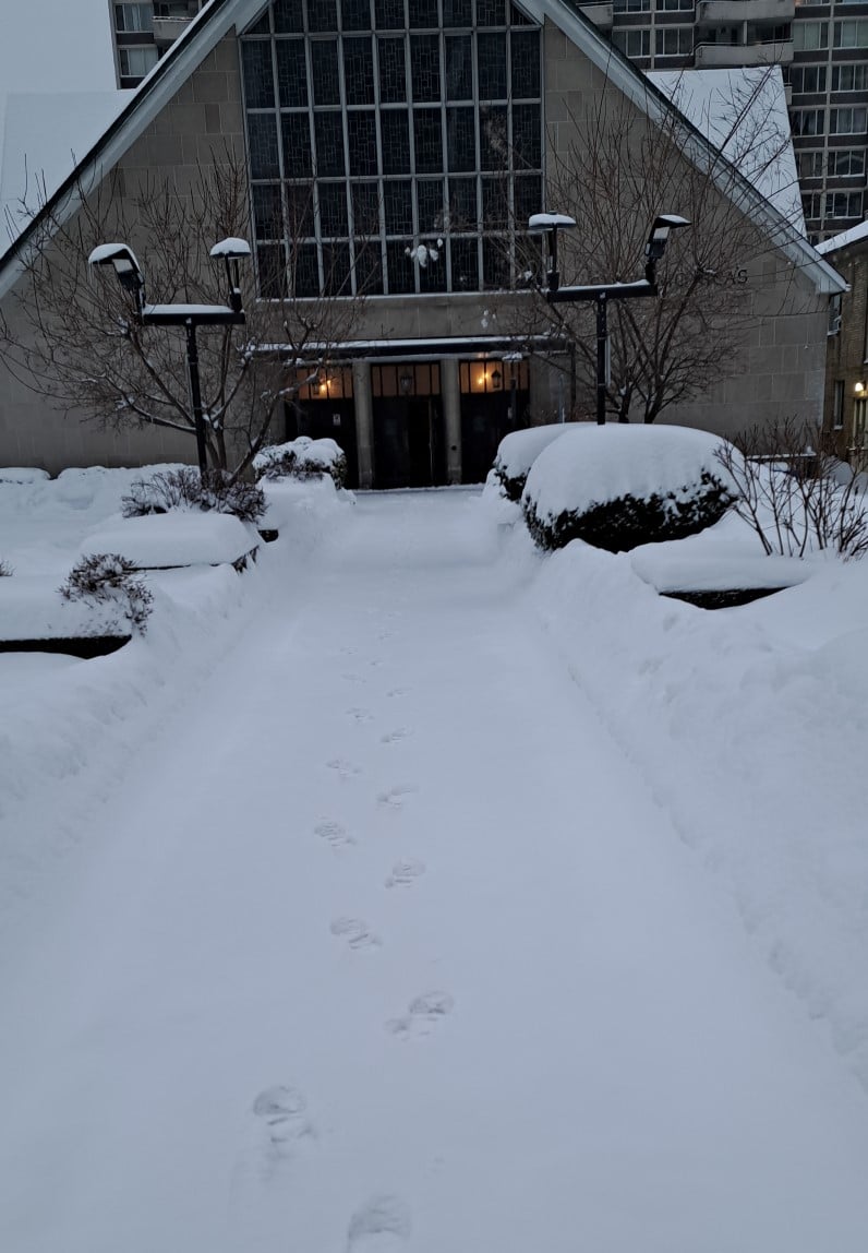 Picture of snow-covered pathway to church front door