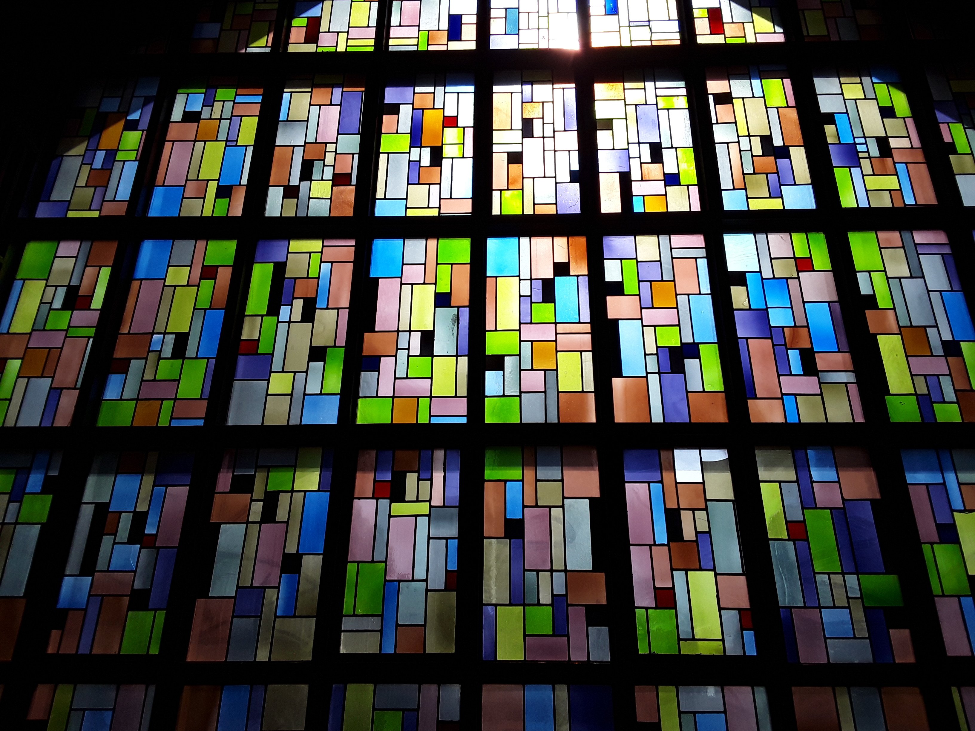 Picture of stained glass windows in front of church