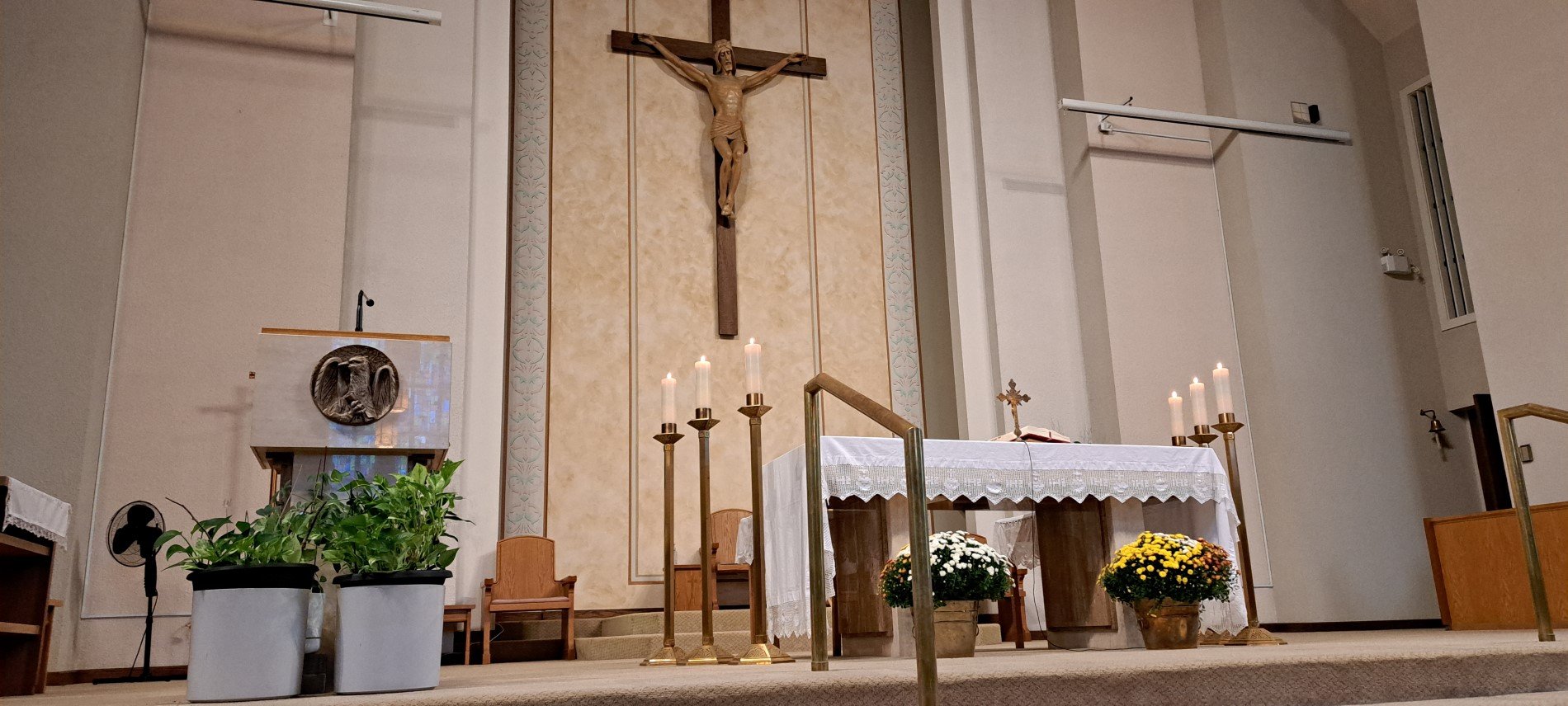 Picture of altar with Fall potted plants at base of altar