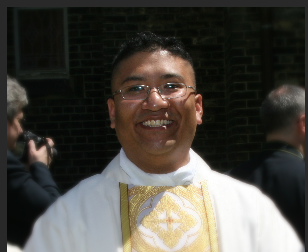 Picture of smiling Father Damian