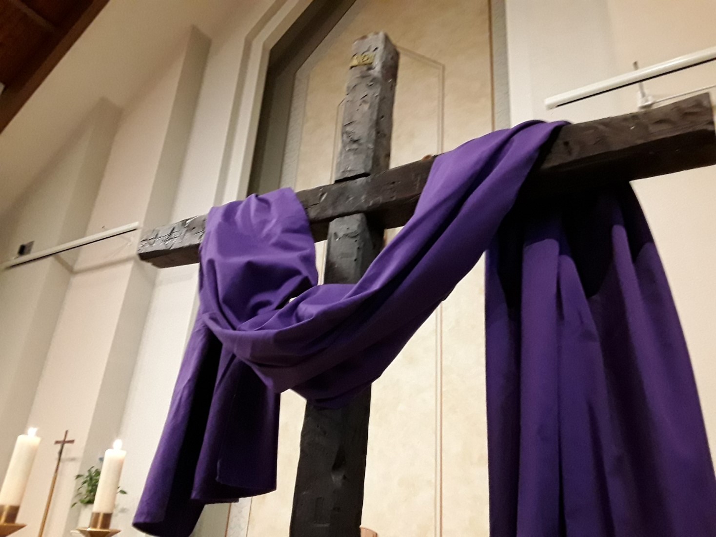 Picture of brown cross with purple cloth draped over