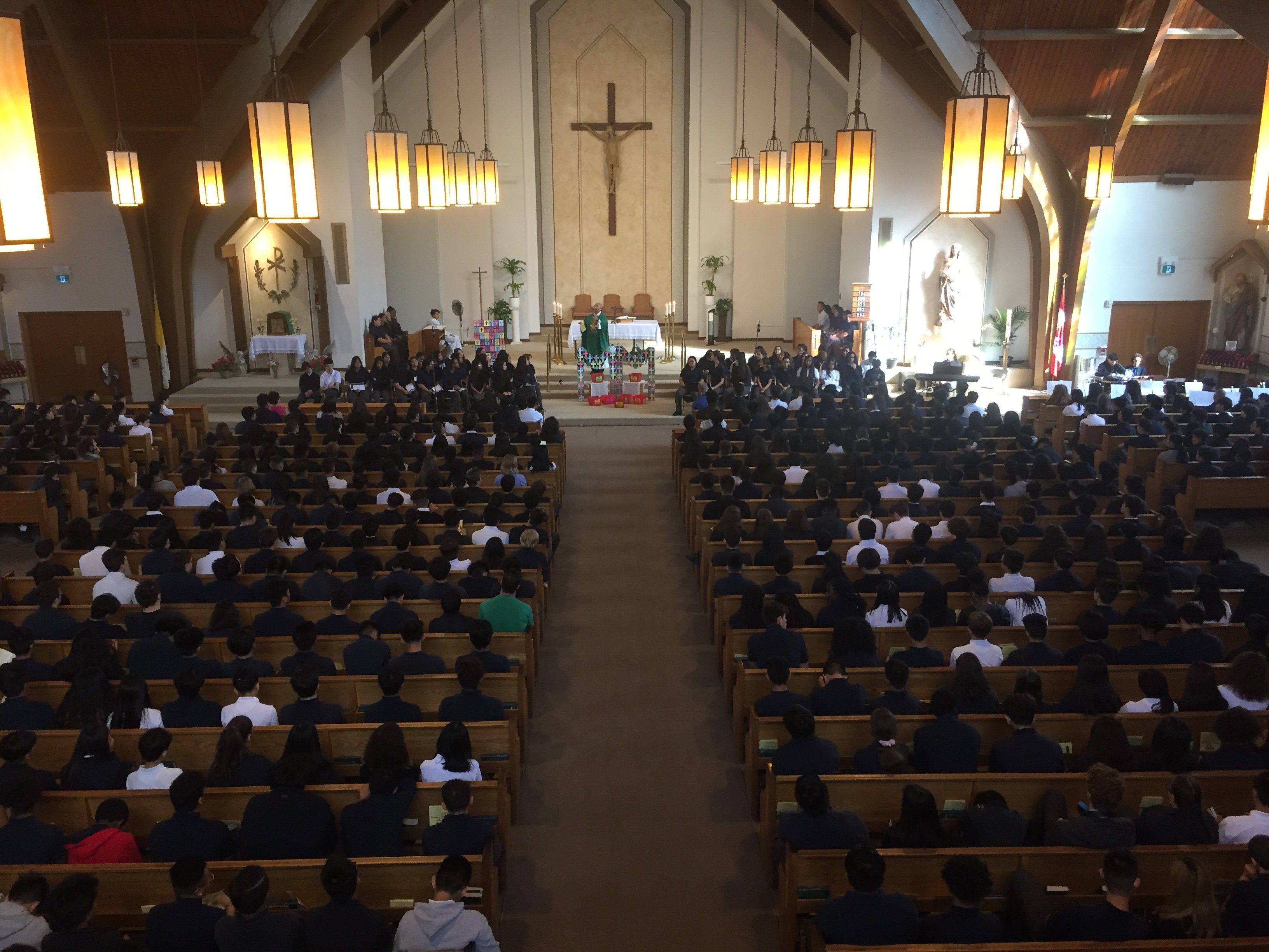 Picture from choir loft of Marshall McLuhan students attending Mass