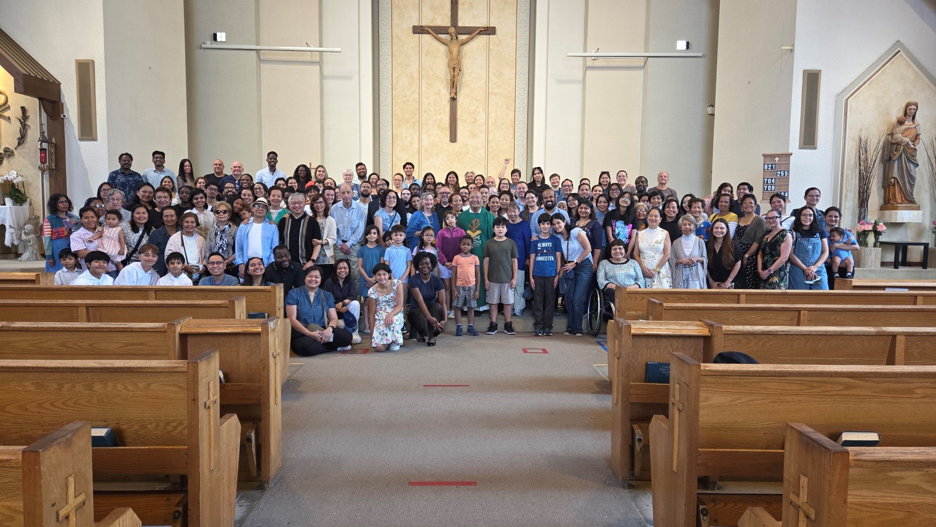 Picture of parishioners in front of the altar taken after the 11 am Mass on Aug. 24, 2025
