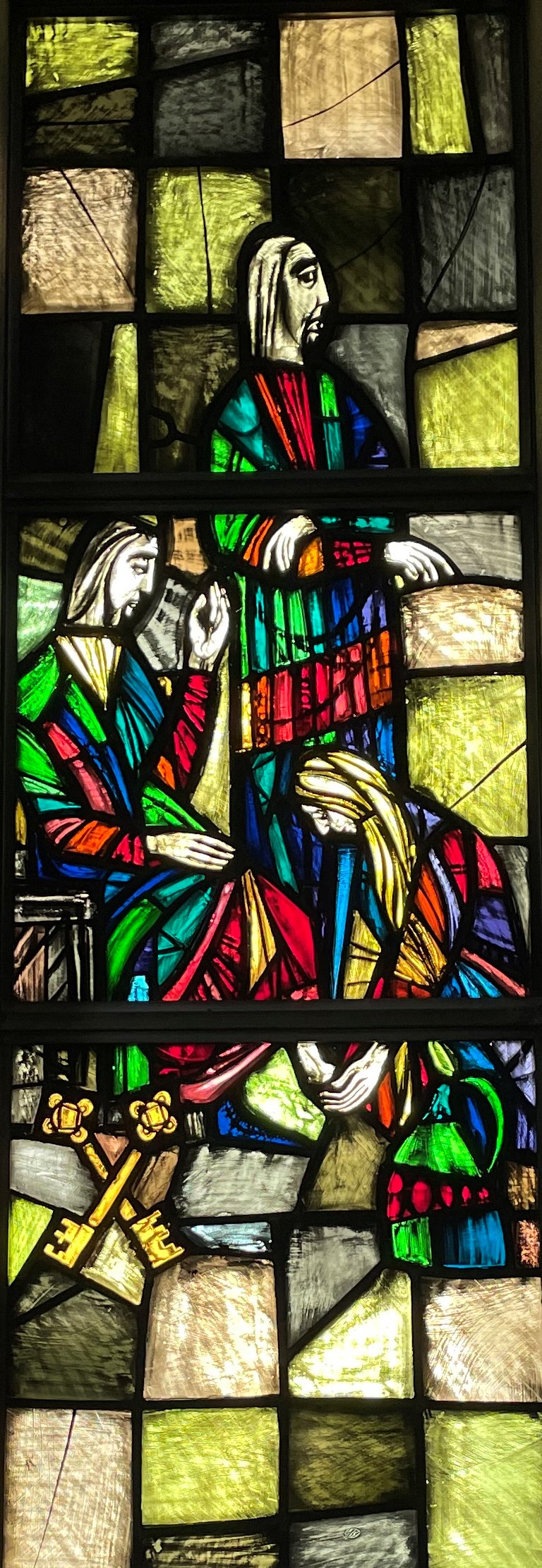 Picture of stained glass window showing a woman washing Jesus' feet