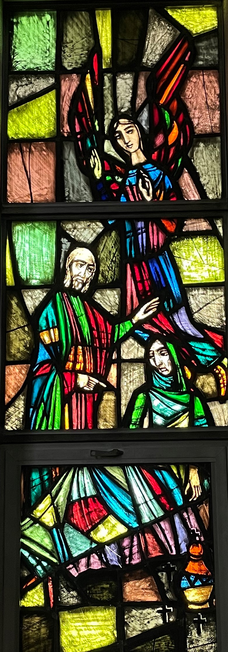Picture of stained glass window showing priest anointing the sick