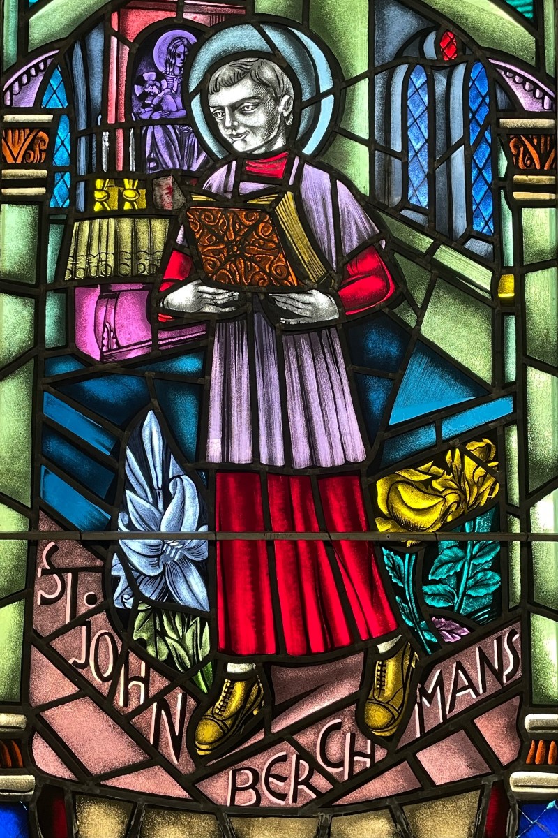 Stained glass window in sacristy showing image of St. John Berchmans