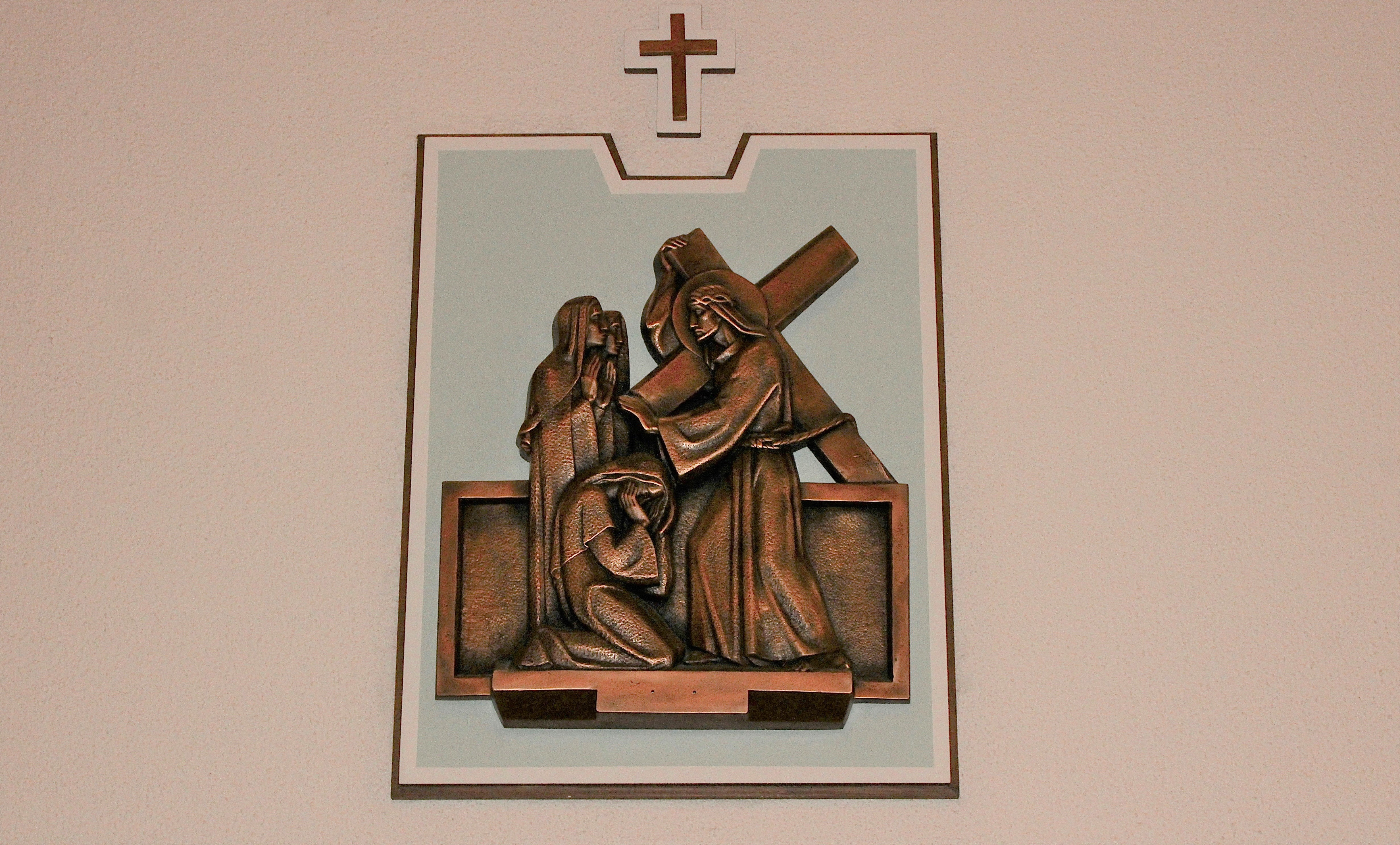Picture of the 8th Station of the Cross plaque inside the church