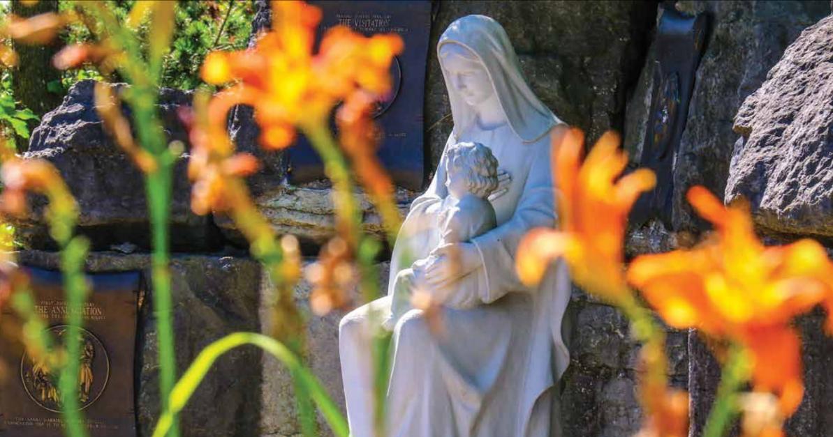 Picture of sculpture of Mother Mary with baby Jesus from a cemetery