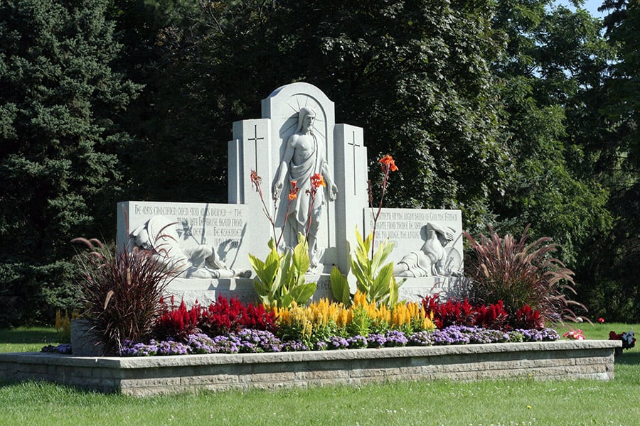 Picture of Sculpture of the risen Christ at cemetery entrance