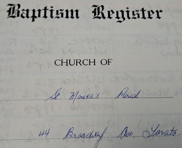Picture of the baptism register cover of St. Monica's Parish